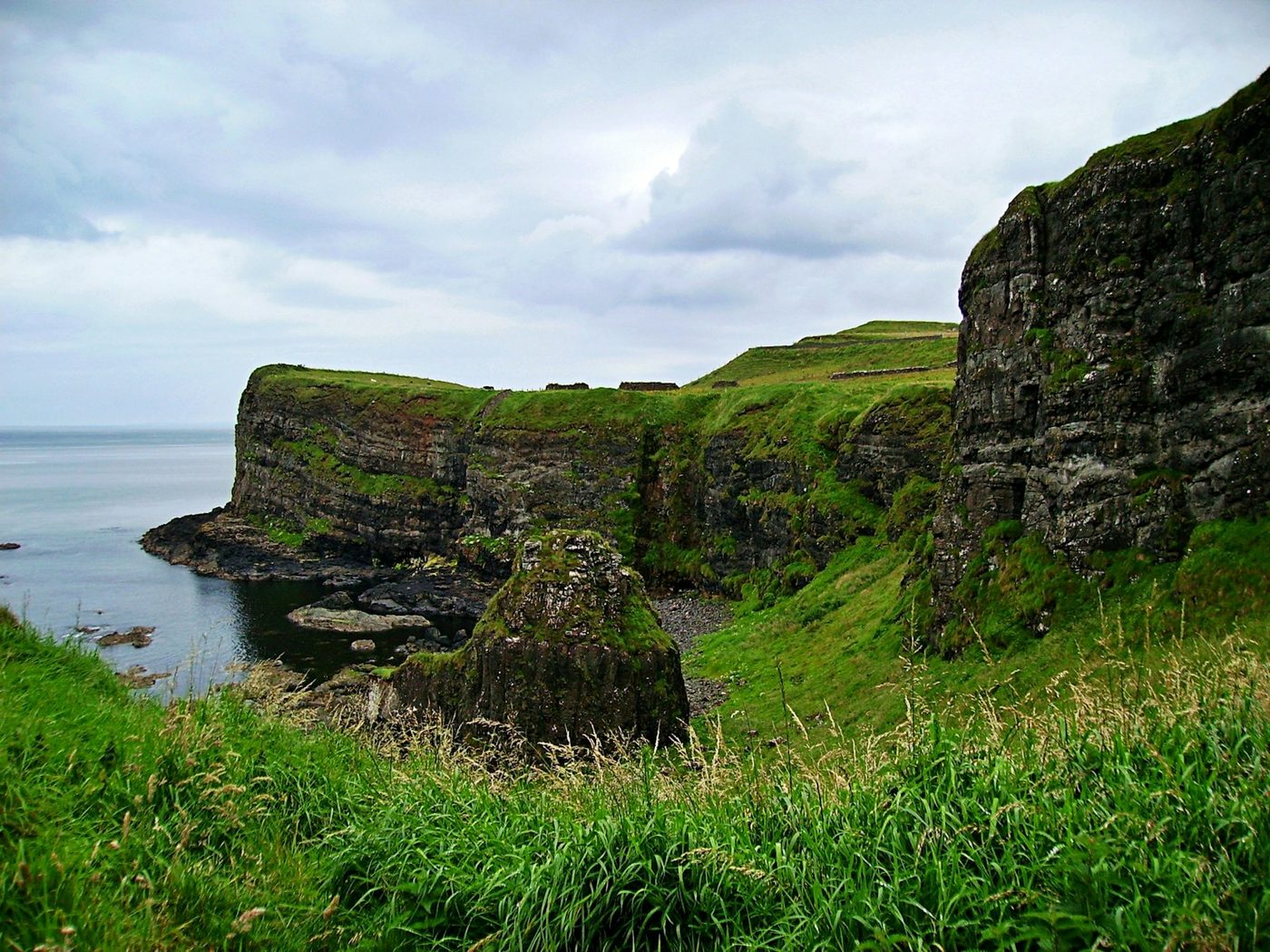 Dramatic Antrim Coast cliffs beside Dunluce Castle
